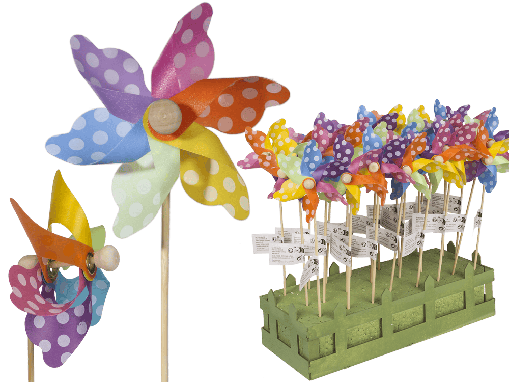 Multicoloured windmilll with white dots on wooden,