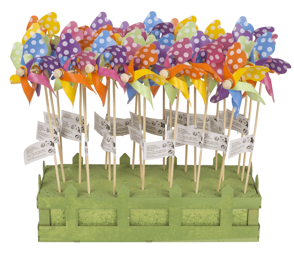 Multicoloured windmilll with white dots on wooden,