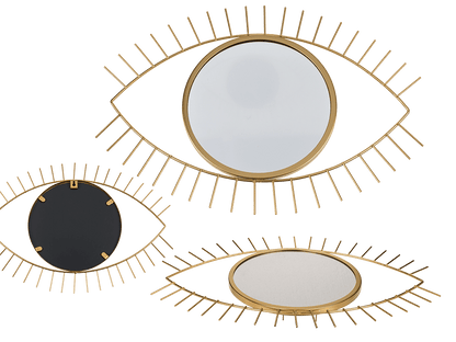 Golden colored metal mirror, eye,