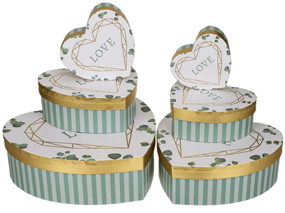 White/green colored present box in heart shape,