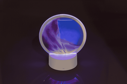 Rotating sand picture, with colour-changing LED