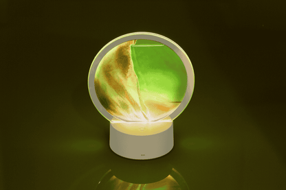 Rotating sand picture, with colour-changing LED