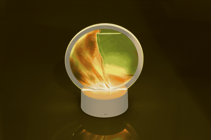 Rotating sand picture, with colour-changing LED