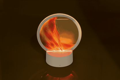 Rotating sand picture, with colour-changing LED