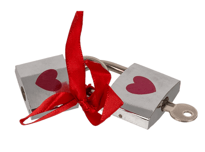 Silver coloured love lock with red heart,