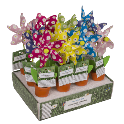 Moulin à vent multicolore dans un pot à plantes