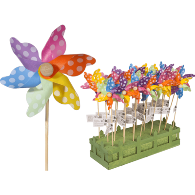 Multicoloured windmilll with white dots on wooden,