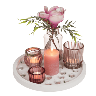 White coloured wooden plate, with pillar candle,