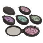 Folding pocket mirror with hair brush,